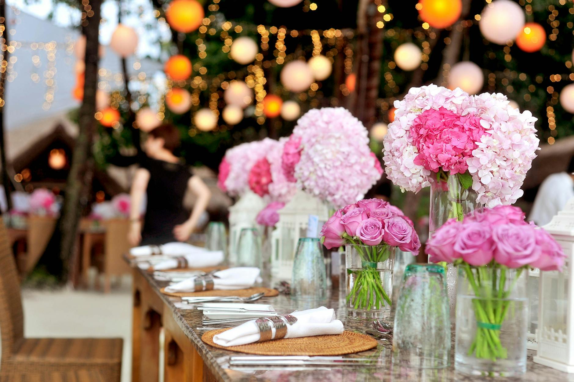 table with plates and flowers filed neatly selective focus photography